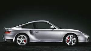 Sophisticated Red Porsche 996 Cruising The Open Road Wallpaper