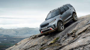 Sovereign Luxury Driving In A Gray Land Rover Discovery Svx Wallpaper