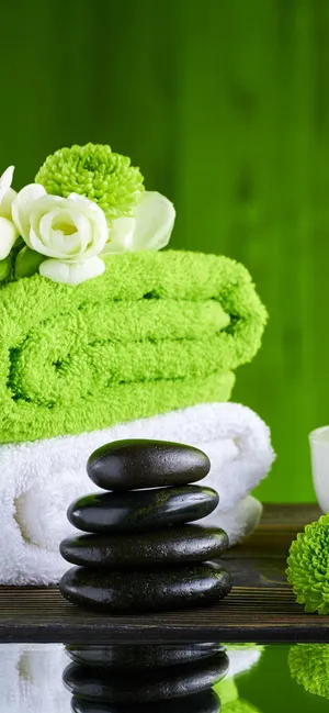 Spa Essentials Green Towelsand Stones Wallpaper