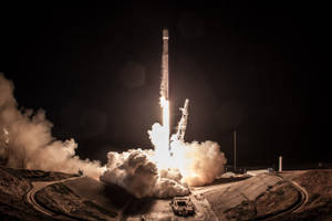 Spacex Launch Rocket At Night Wallpaper