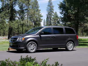 Spacious Dodge Grand Caravan On Road Wallpaper