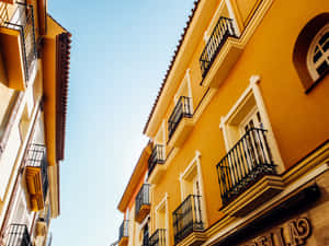 Spanish Yellow Building Facade Wallpaper