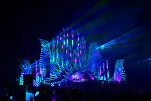 Spectacular D J Stage Lightingat Night Wallpaper