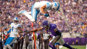 Spectacular Football Catch Mid Air Wallpaper