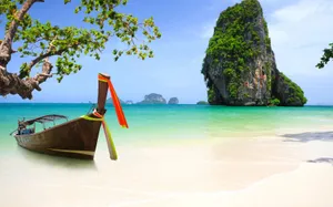 Spectacular Sunset Over Serene Thailand Beach Wallpaper