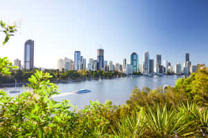 Spectacular View Of Brisbane Skyline At Sunset Wallpaper