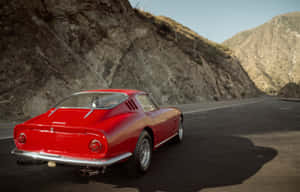 Speed And Style - Driving A Classic Ferrari Wallpaper