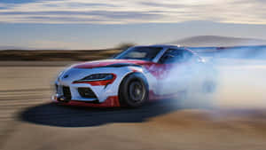 Speed Through The Roads With The Supra Drift Wallpaper