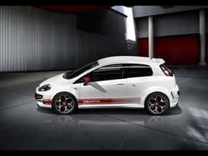 Speed Unleashed - Abarth Racing Car On Track Wallpaper