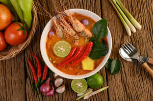 Spicy Tom Yum Soup With Chillies And Prawns Wallpaper