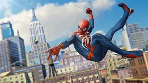 Spider-man Gracefully Swings Through The City Wallpaper