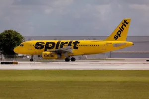 Spirit Airlines Plane On Green Grass Wallpaper