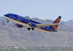 Splendid Blue Aircraft Of Sun Country Wallpaper