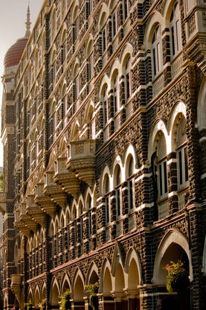 Splendid Facade Of The Taj Mahal Palace In Mumbai Wallpaper