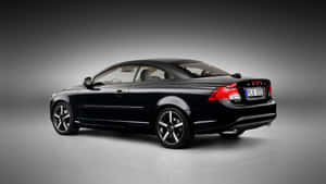 Splendid Silver Volvo C70 Cruising On An Open Highway Wallpaper