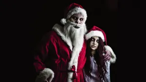 Spooky Santa And Ghostly Girl Wallpaper