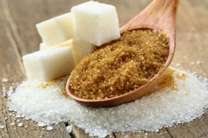 Spoonful Of Brown Sugar With White Cubes Aesthetic Wallpaper