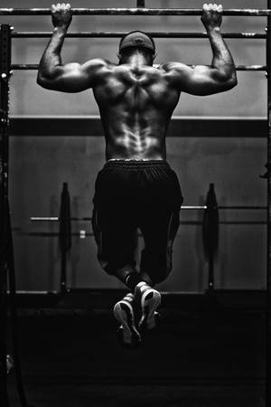 Sport Bodybuilder Doing Pull-ups Wallpaper