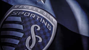 Sporting Kansas City Logo On Blue Jersey Wallpaper