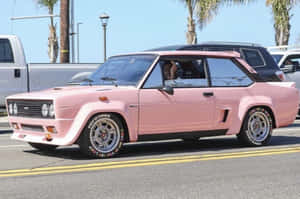 Sporty Abarth 695 Cruising On The Asphalt Wallpaper