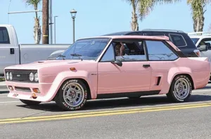 Sporty Abarth 695 Cruising On The Asphalt Wallpaper