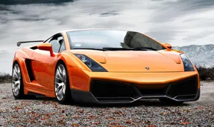 Sporty Elegance - Lamborghini Gallardo On The Open Road Wallpaper