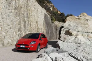 Sporty Fiat Punto In Scenic Landscape Wallpaper