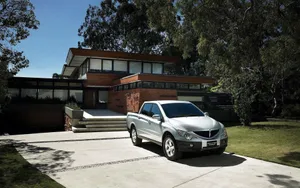 Ssangyong Sports Suv On The Road Wallpaper