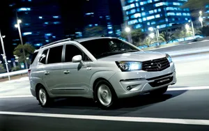 Ssangyong Suv Driving On A Countryside Road Wallpaper