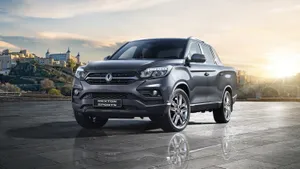 Ssangyong Suv On A Scenic Mountain Road Wallpaper