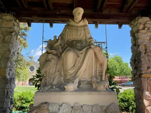 St Francis Assisi Statue Outdoor Setting Wallpaper