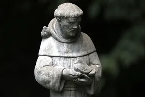 St Francis Statue With Bird Wallpaper