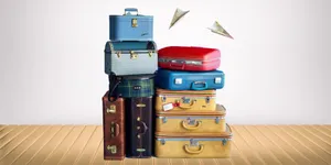 Stacked Vintage Suitcases Travel Concept Wallpaper