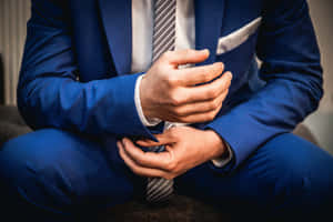 Stand Out From The Crowd In A Sharp Navy Blue Suit Wallpaper