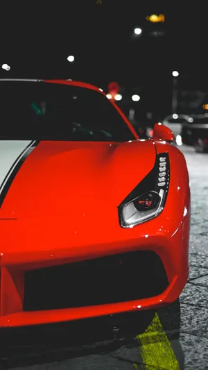 Stand Out From The Crowd With The Stylish Red Car Iphone Wallpaper