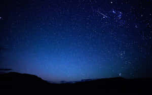 Star Sky With Hilly Terrain Wallpaper