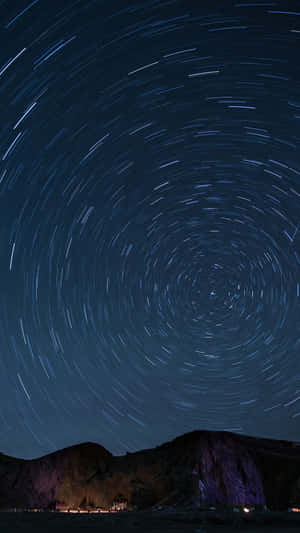 Star_ Trails_ Over_ Mountainous_ Landscape.jpg Wallpaper