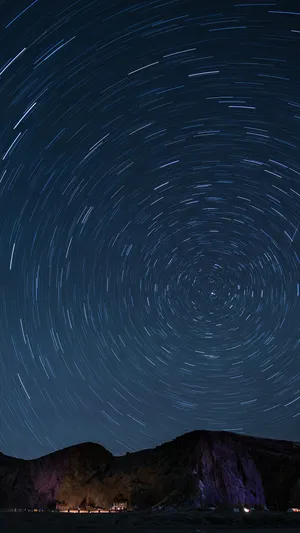 Star_ Trails_ Over_ Mountainous_ Landscape.jpg Wallpaper