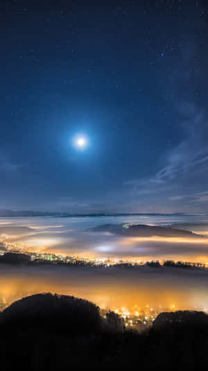 Starry_ Night_ Over_ Misty_ Town.jpg Wallpaper