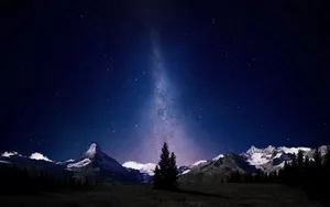 Starry_ Night_ Over_ Snowy_ Mountains.jpg Wallpaper