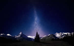 Starry Night Over Snowy Mountains.jpg Wallpaper