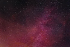 Starry Night Sky Burgundy Glow Wallpaper