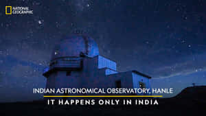 Starry Night Sky Over A Mountain Observatory Wallpaper