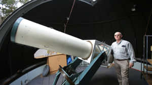 Starry Night Sky Over An Observatory Wallpaper