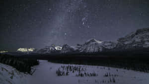 Starry_ Winter_ Night_ Mountain_ View_4 K.jpg Wallpaper