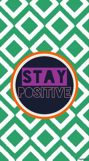 Stay Positive - A Green And Orange Pattern With The Words Stay Positive Wallpaper