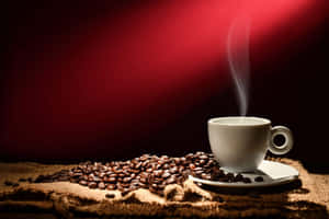 Steaming Coffee Cupand Beans Wallpaper