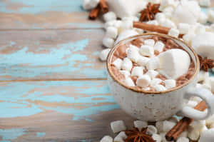 Steaming Hot Chocolate In A Mug With Marshmallows Wallpaper