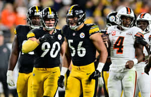 Steelers Players Celebratingon Field Wallpaper