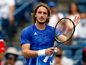 Stefanos Tsitsipas Palming His Racket Wallpaper